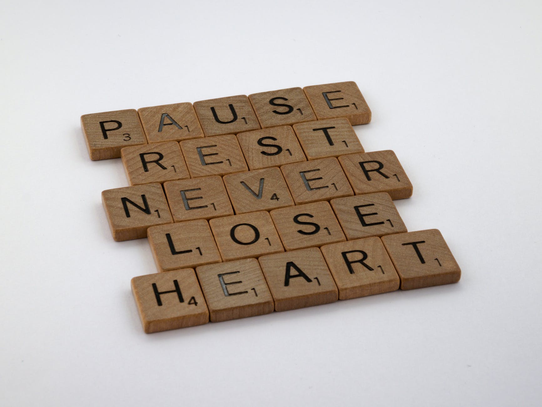 close up of various words spelled out in scrabble tiles
